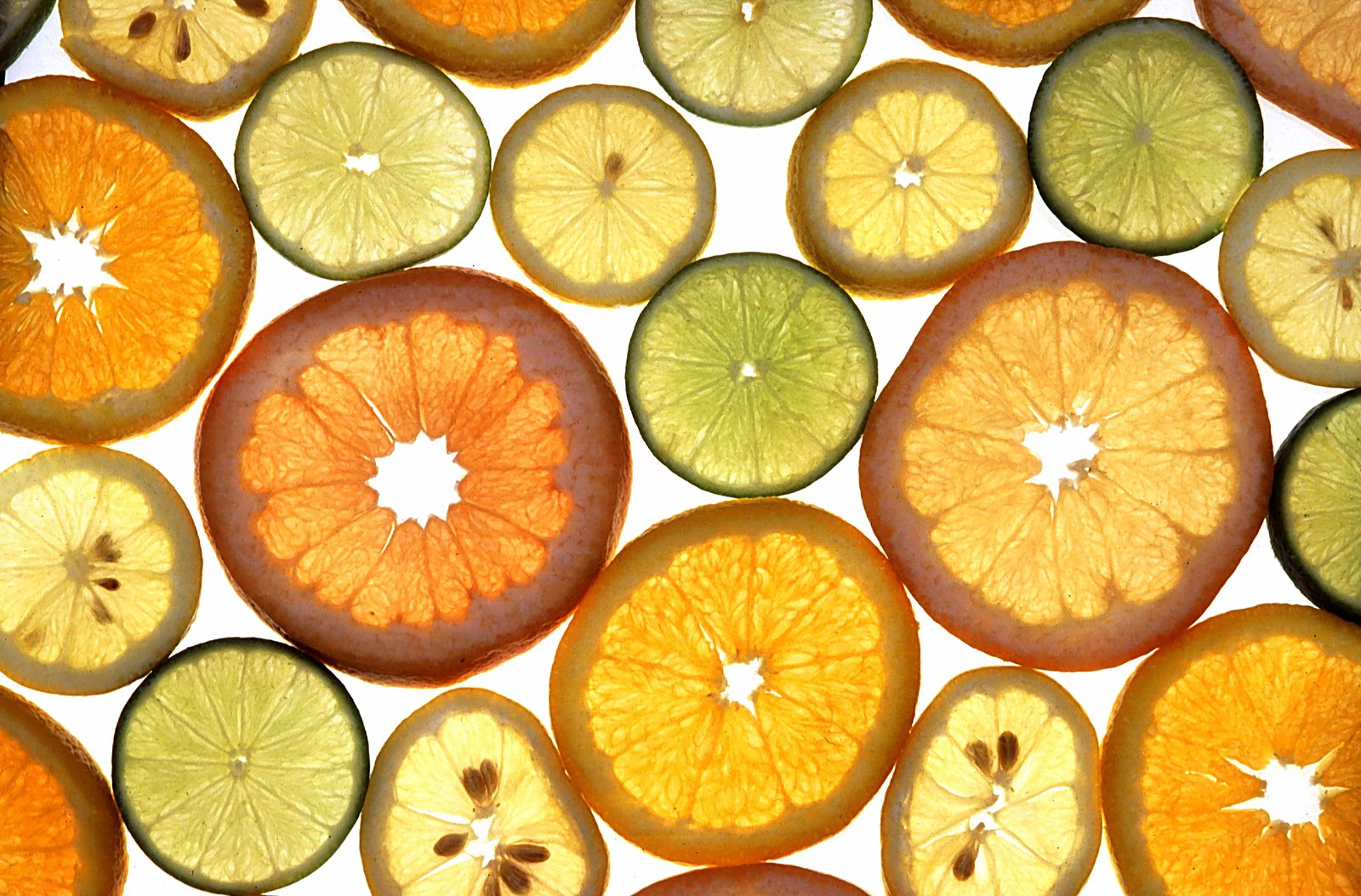 An assortment of whole citrus fruits, including oranges, grown in the United States
